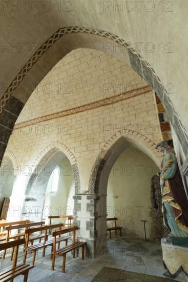 Painted church St Aignan's Church of Begues. Ogival arcades. Allier department. Auvergne Rhone