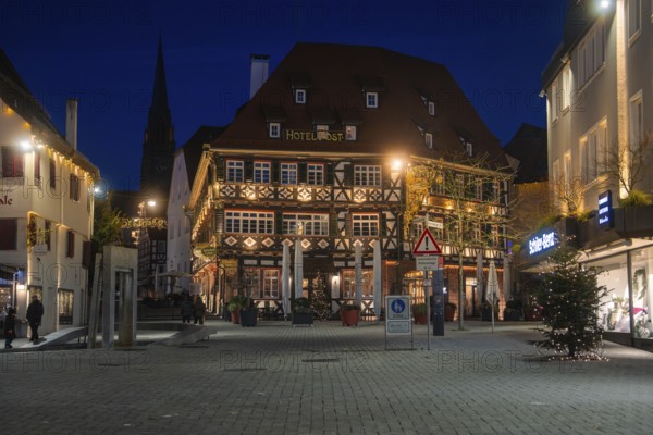 Night view of a traditionally designed half-timbered hotel in the city center, Nagold, Calw