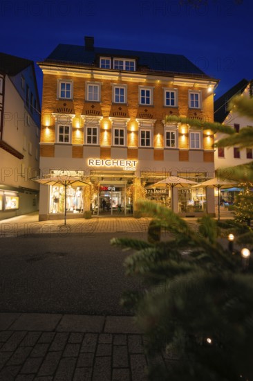 Festively illuminated building in the urban evening atmosphere, Nagold, Calw district, Black