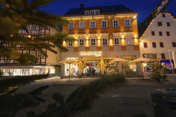 Illuminated facades of a building with Christmas decoration in the city, Nagold, Calw district,