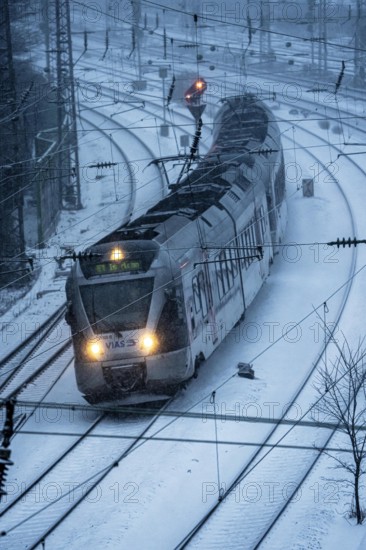 Winter weather, snowfall, VIAS regional express, regional traffic, on the route east, in front of