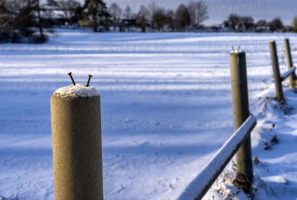Detailed photo, concrete fence post on a field in Berlin-Lübars, Germany