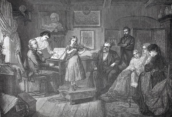 The little musician, girl playing the violin in front of the family, accompanied on the piano by