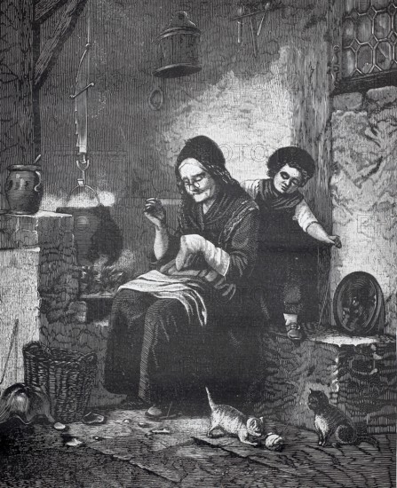 Old woman doing sewing work, sitting at the stove while a girl plays on the cats with balls of