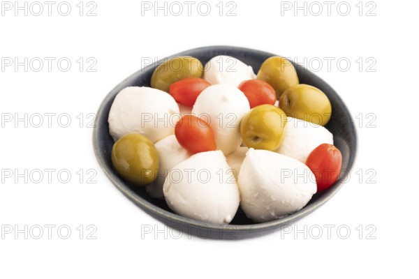 White Mozzarella cheese, with tomatoes and olives in blue bowl Isolated on white background, side