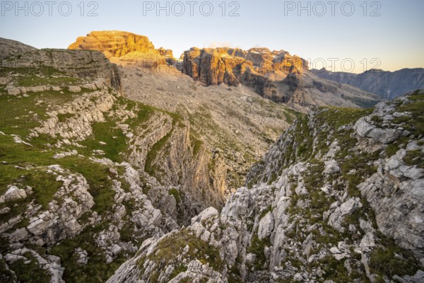 View of rocky mountain peaks of the Brenta Mountains at sunset, Alpenglühen, mountain landscape on