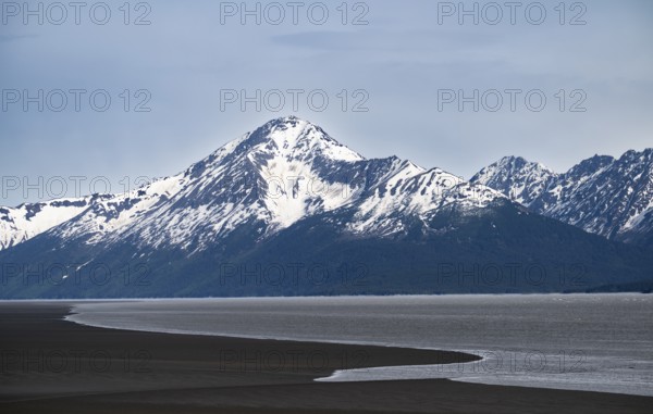 View of the Turnagain Arm estuary at low tide to the mountains of the Kenai Peninsula, Anchorage,