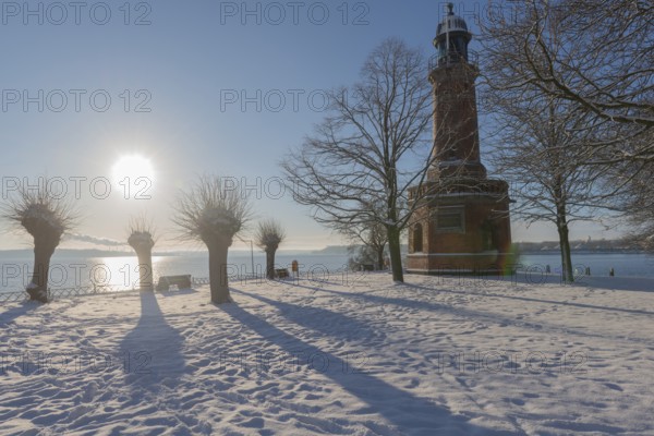 Holtenau lighthouse at the entrance of the Kiel Canal in winter, west bank of the Kiel Fjord,