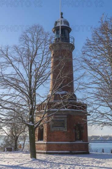 Holtenau lighthouse at the entrance of the Kiel Canal in winter, west bank of the Kiel Fjord,