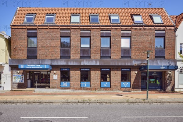 Tourist information, library leak, public library, commercial building, brick building, façade with