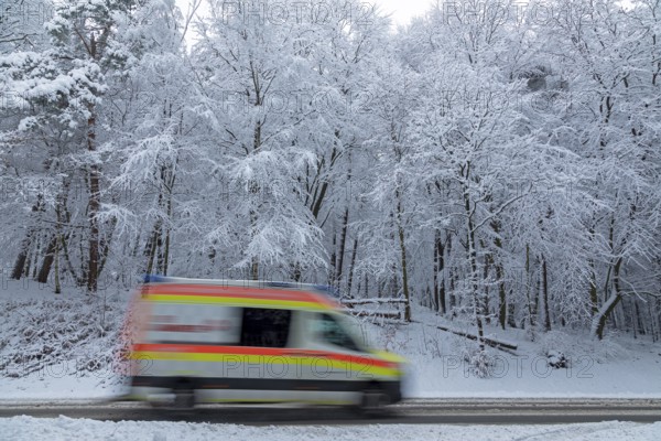 Ambulance driving through snowy landscape, trees, winter, snow, Sieversen, Samtgemeinde