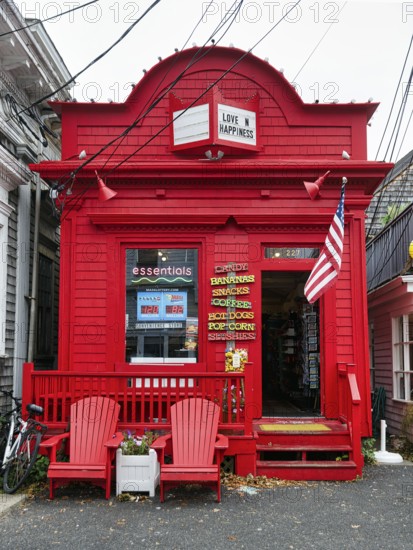 Bright red facade, fast food shop, candy, coffee, inscription love and happiness, American flag,