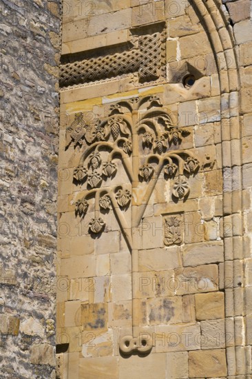 Detail of a historic building with a sandstone tree relief decorated with leaves, Ananuri Castle,