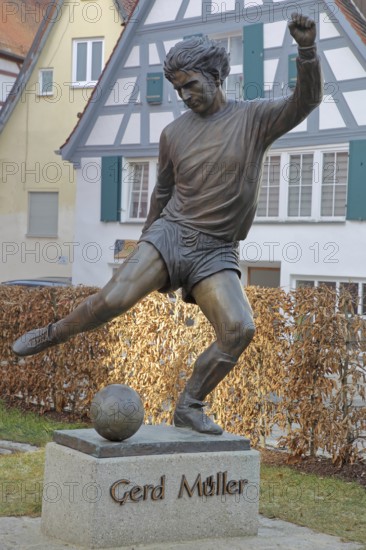 Memorial to soccer player Gerd Müller, German national team player, soccer legend, bronze
