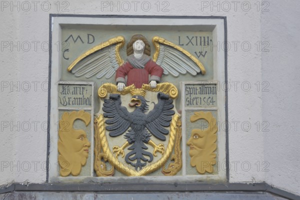 City coat of arms at the former Holy Spirit Hospital building built in 1564, inscription, year,