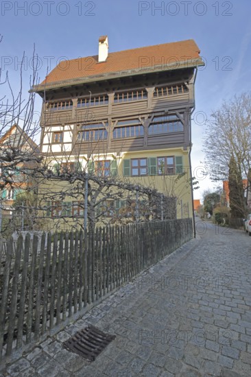 Historic half-timbered house with wooden fence, Mittlere Gerbergasse, Nördlingen, Bavaria, Germany