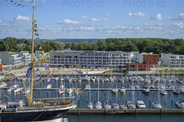 Harbour view with the legendary four-masted PASSAT barque and many boats in front of modern