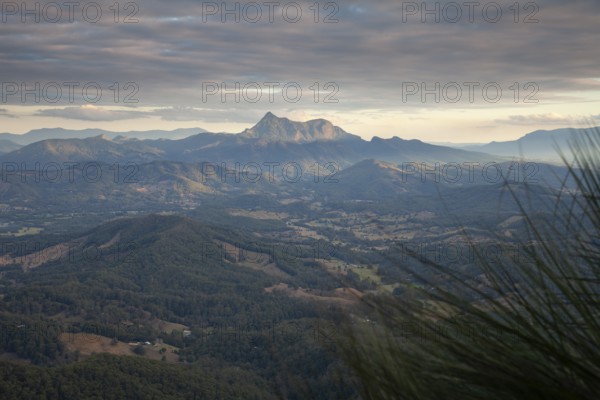 Sunset with an open view across the valley toward Mount Warning (Wollumbin), captured from the