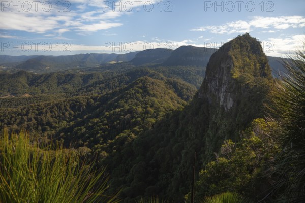 Clear blue sky with an open view toward the Mount Cougal summit, showing natural ridges and