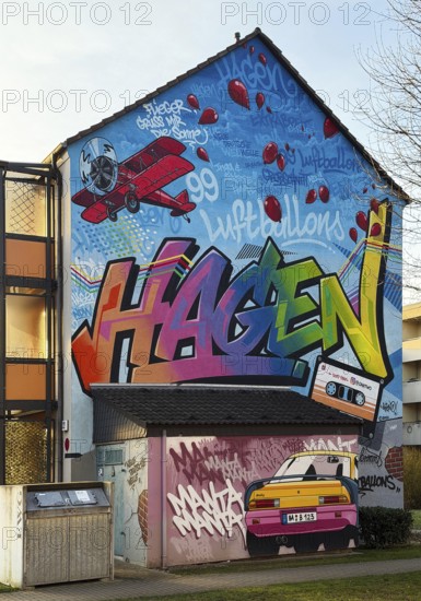 Street art with the music theme Neue Deutsche Welle on a house façade, apartment building in the