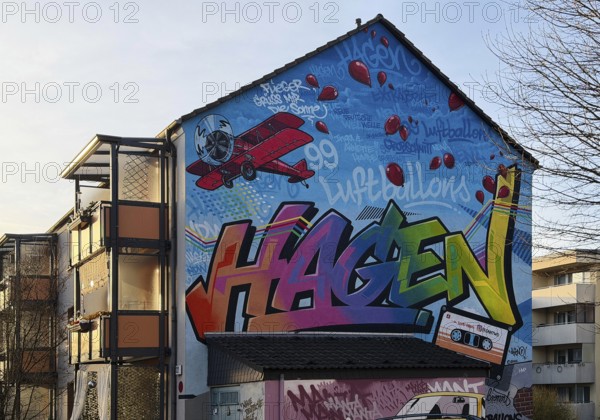 Street art with the music theme Neue Deutsche Welle on a house façade, apartment building in the