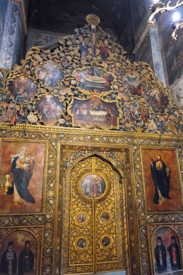 Detailed religious icons with golden decoration in an artfully designed church interior, Bodbe