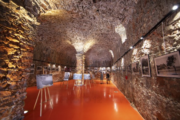 Exhibition at the Porto tourist office, a former Genoese weapons warehouse, interior view, Ota,