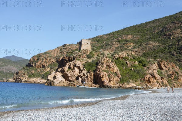 Genoese tower on the pebble beach of Porto, Ota, west coast of Corsica, Corse-du-Sud, Corsica,