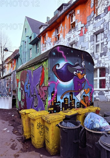 Kiefernstraße with street art and artistically designed construction trailer and street art from
