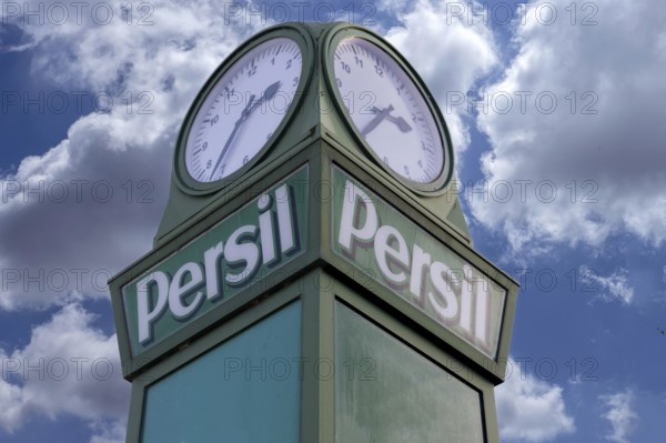 Detail of the persimmons clock, neon sign for the Henkel company, this historic persimmon clock was