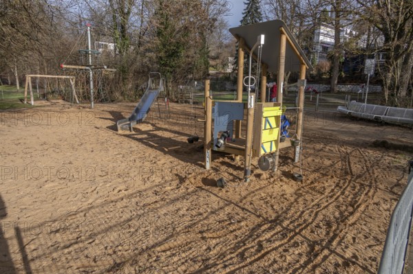 Various play equipment on an empty playground, Heroldsberg, Middle Franconia, Bavaria, Germany