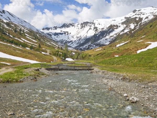 Riedingtal nature park Park, Riedingbach, snow-capped mountains, stream with bridge, hiking,