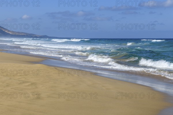 Strong dangerous surf from the Atlantic with waves and undercurrents on the beach on the west coast