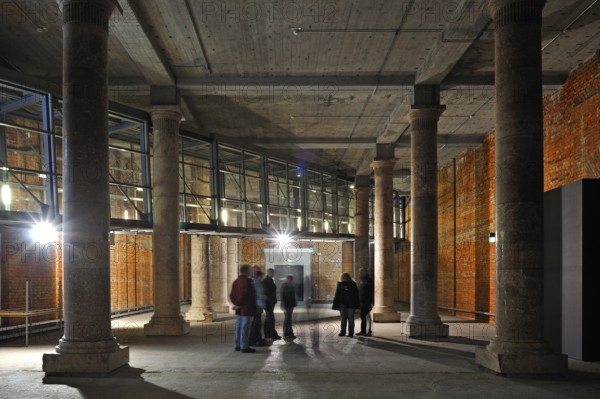 Small column hall, with group of visitors, the unfinished NS Congress Hall, 1943, deliberately