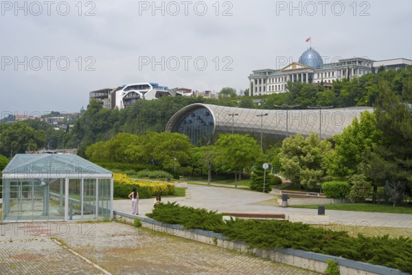 Glass-covered architecture in a park with green spaces, Rike Music Theatre and Exhibition Center,