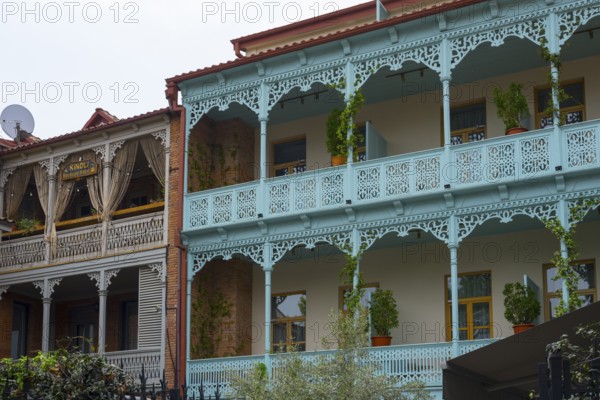 Traditional Caucasian architecture with decorated balconies and wooden railings decorated with
