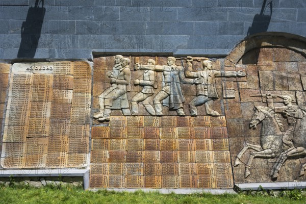 Stone relief with figures and memorial plaque in a historical illustration, commemoration of World