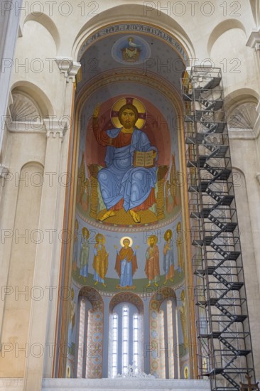 Interior view of a church with tall domes and magnificent frescoed icon paintings, Sameba