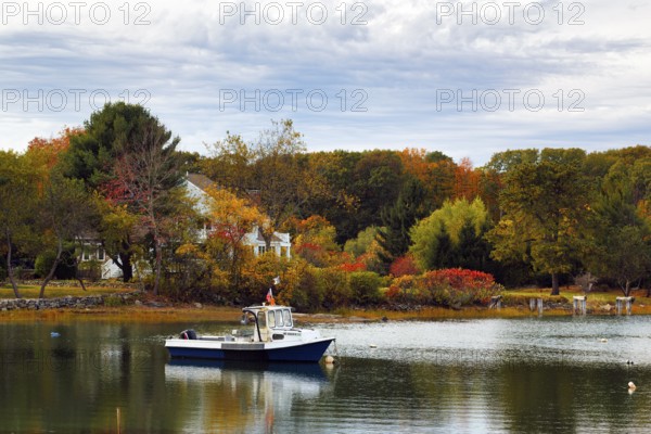 Scenic river landscape, lobster boat, riverbank fishing boat, autumn leaves, Indian summer,