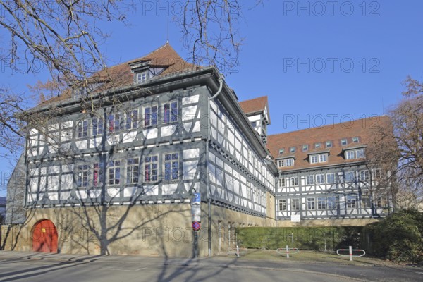 Historic half-timbered house built in 14th century and Friedrich-List-Gymnasium, Reutlingen,