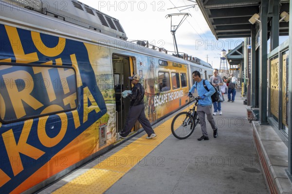 Arvada, Colorado - Passengers board Denver's light rail train system at the Olde Town Arvada
