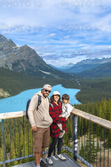 Tourists are admiring the stunning turquoise waters of peyto lake, surrounded by majestic canadian