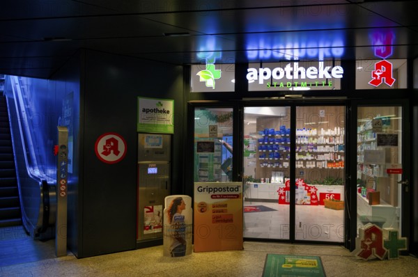 Night view, pharmacy city center, logo, underpass, escalator, neon light, illuminated, Stuttgart,