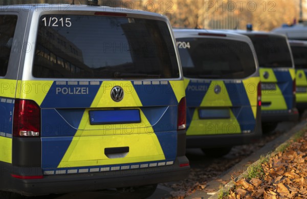 Various police vehicles, police cars, police vans, from behind, parked, Stuttgart,