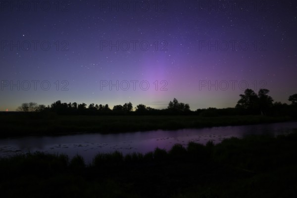 Aurora borealis aurora borealis on the Hunte dyke, Dümmerniederung nature park Park, Lower Saxony,