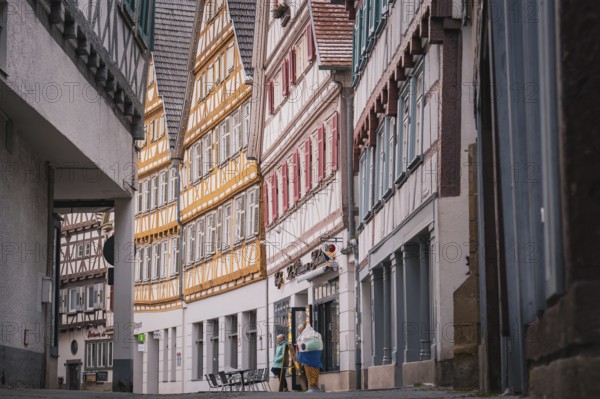 Narrow street with numerous half-timbered houses in the old town, Herrenberg, Böblingen district,