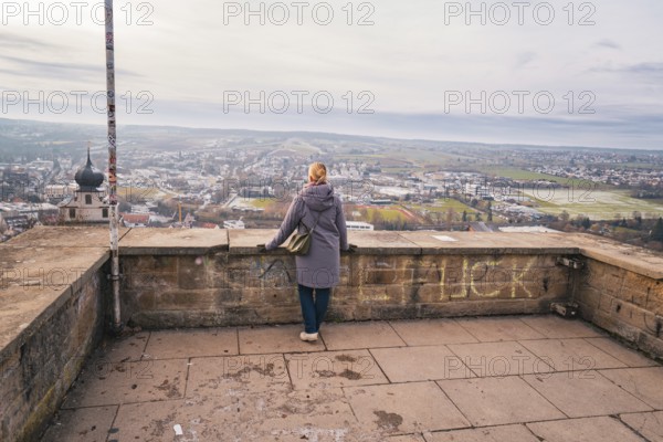 Quiet scene with a woman looking at the wide panorama from a platform, Herrenberg, Böblingen