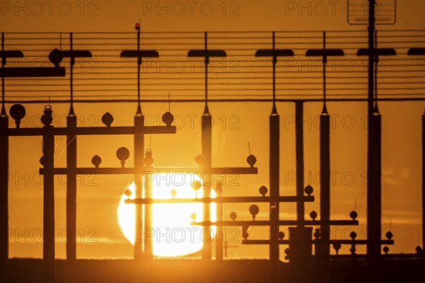 Runway lighting, approach aids, at Düsseldorf International Airport, sunset, Hauptbahn Süd,