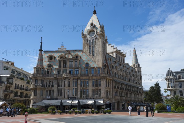 Historic building with roof gables in a public square under clear sky, Europe Square, Batumi, Black