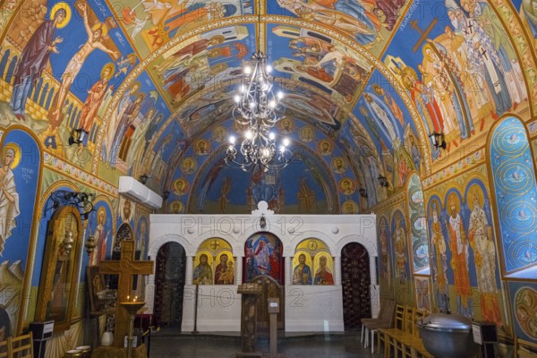 Beautifully painted Orthodox church with religious frescoes and spiritual atmosphere, St. Barbara